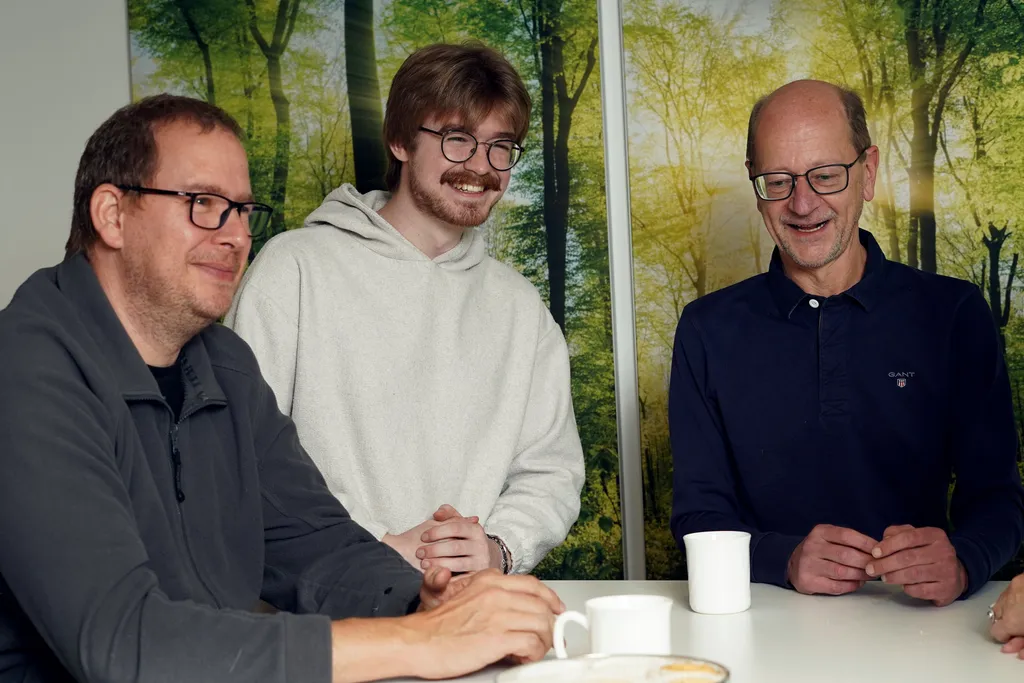 Three people having an informal meeting